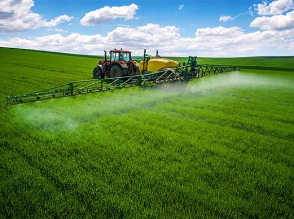 tractor spraying a field
